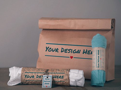 Paper Bag and 2 Rolled T-Shirts Mockup 319877958