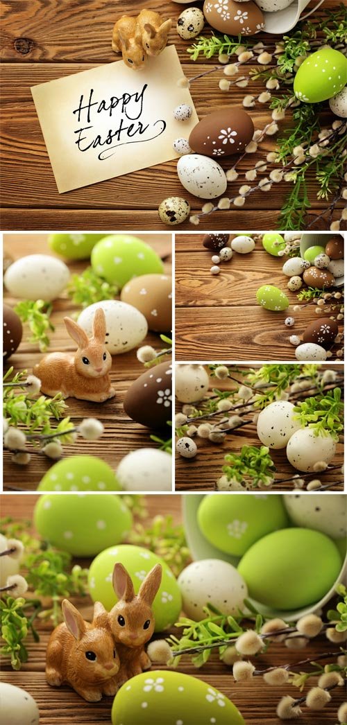 Easter bunnies and vine branches on wood background stock photo